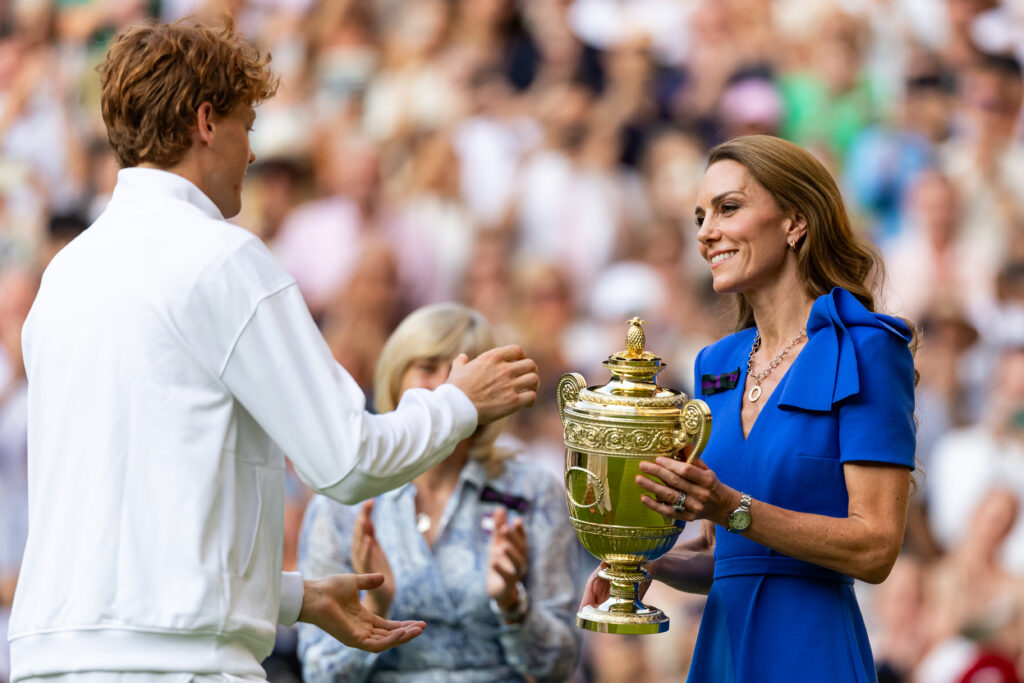 Jannik Sinner of Italy receives the winner's trophy from Catherine, Princess of Wales after his victory over Carlos Alcaraz of Spain during the final of the gentlemen's singles on day fourteen of The Championships Wimbledon 2025 at All England Lawn Tennis and Croquet Club on July 13, 2025 in London, England.