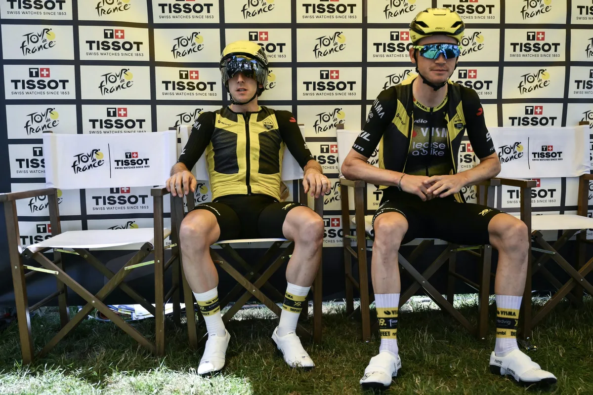 Team Visma - Lease a bike team's British rider Simon Yates and Team Visma - Lease a bike team's US rider Sepp Kuss await to take the start of the 13th stage of the 112th edition of the Tour de France cycling race, 10.9 km individual time trial between Loudenvielle and Peyragudes, in the Pyrenees mountains of southwestern France, on July 18, 2025. (Photo by Marco BERTORELLO / AFP) (Photo by MARCO BERTORELLO/AFP via Getty Images)