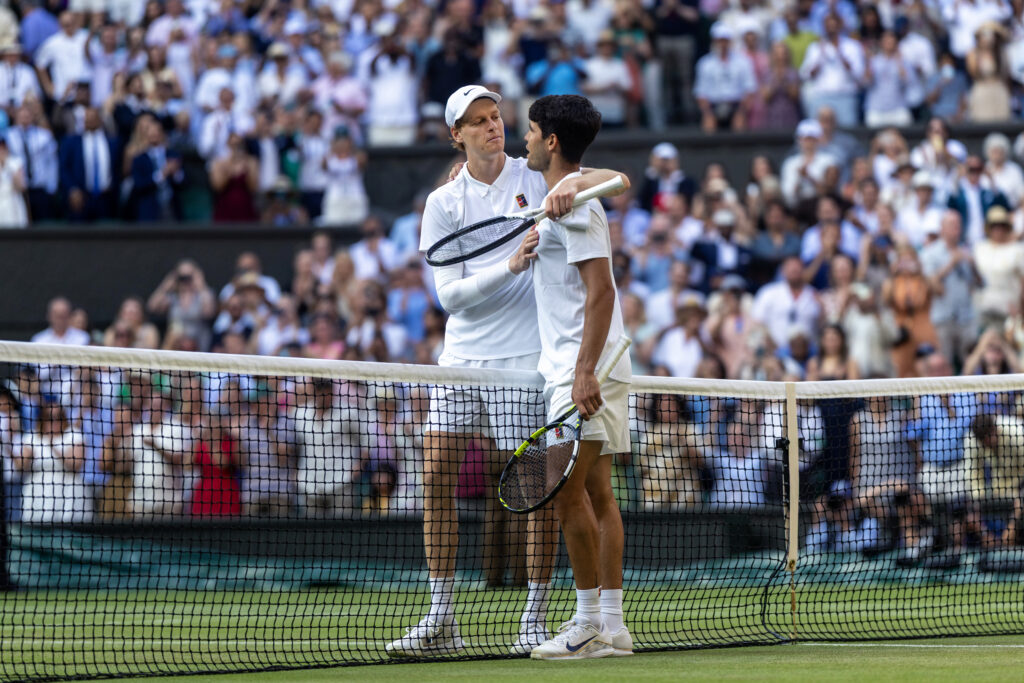 Winner Jannik Sinner of Italy and Carlos Alcaraz of Spain embrace at the net after the Gentlemen's Singles Final on Centre Court during the Wimbledon Lawn Tennis Championships at the All England Lawn Tennis and Croquet Club at Wimbledon on July 13th, 2025, in London, England.