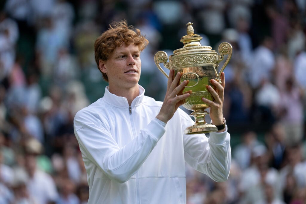 Jannik Sinner of Italy poses with the Gentlemen’s Singles Trophy following his victory against Carlos Alcaraz of Spain during the Gentlemen’s Singles Final on day fourteen of The Championships Wimbledon 2025 at All England Lawn Tennis and Croquet Club.