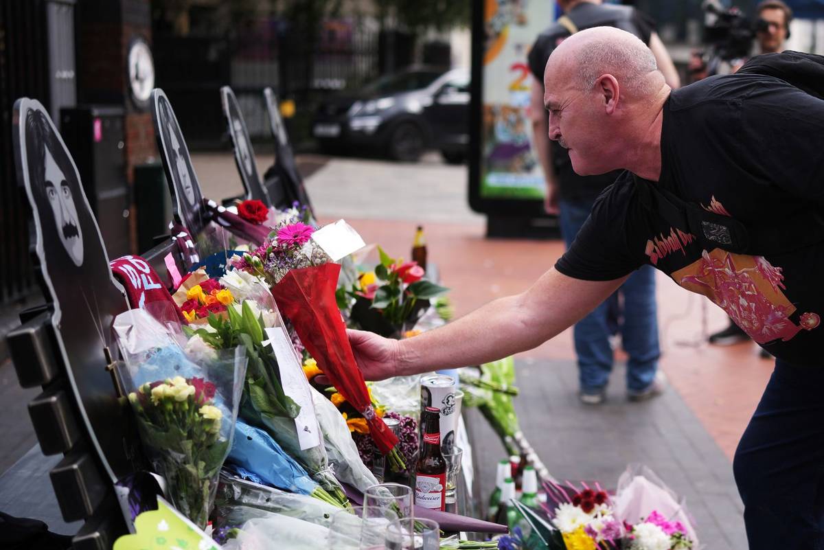 BIRMINGHAM, ENGLAND - JULY 23: Flowers, candles, drinks and messages in memory of Ozzy Osbourne are left on the Black Sabbath Bridge bench on Broad Street on July 23, 2025 in Birmingham, England. Ozzy Osbourne, the legendary rock icon and Black Sabbath frontman, died on Tuesday, aged 76, after performing a farewell show in his hometown of Birmingham earlier this month. Over the course of his storied career as a singer-songwriter and media personality, he brought home five Grammy Awards and was twice inducted into the Rock and Roll Hall of Fame - once as a member of Black Sabbath, and again as a solo artist. (Photo by Christopher Furlong/Getty Images)
