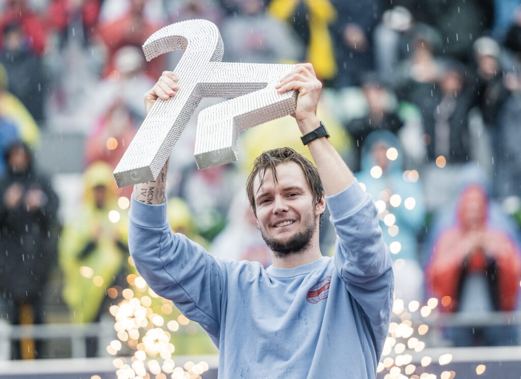 Kazakhstan's Alexander Bublik lifts his trophy