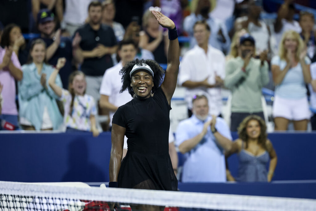 Venus Williams smiles and waves