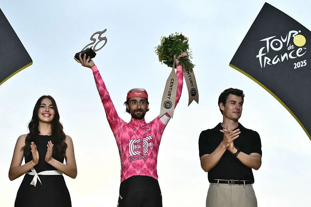 EF Education - EasyPost team's Irish rider Ben Healy celebrates on the podium with the most combative rider's award after the 21st and final stage of the 112th edition of the Tour de France cycling race, 132.3 km between Mantes-la-Ville and Paris Champs-Élysees, on July 27, 2025. (Photo by Marco BERTORELLO / AFP) (Photo by MARCO BERTORELLO/AFP via Getty Images)