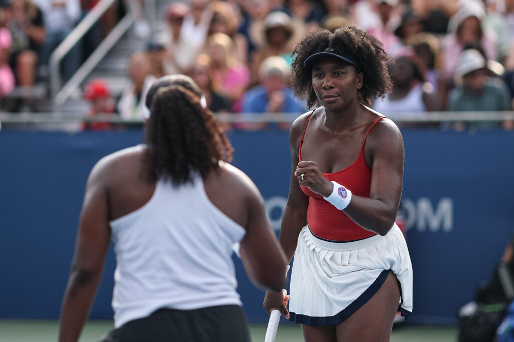 Venus Williams (R) and Hailey Baptiste celebrate after a point against Shuai Zhang and Taylor Townsend (not pictured) during a women's doubles match on day 3 of the Mubadala Citi DC Open 2025 at William H.G. FitzGerald Tennis Center on July 23, 2025 in Washington, DC.