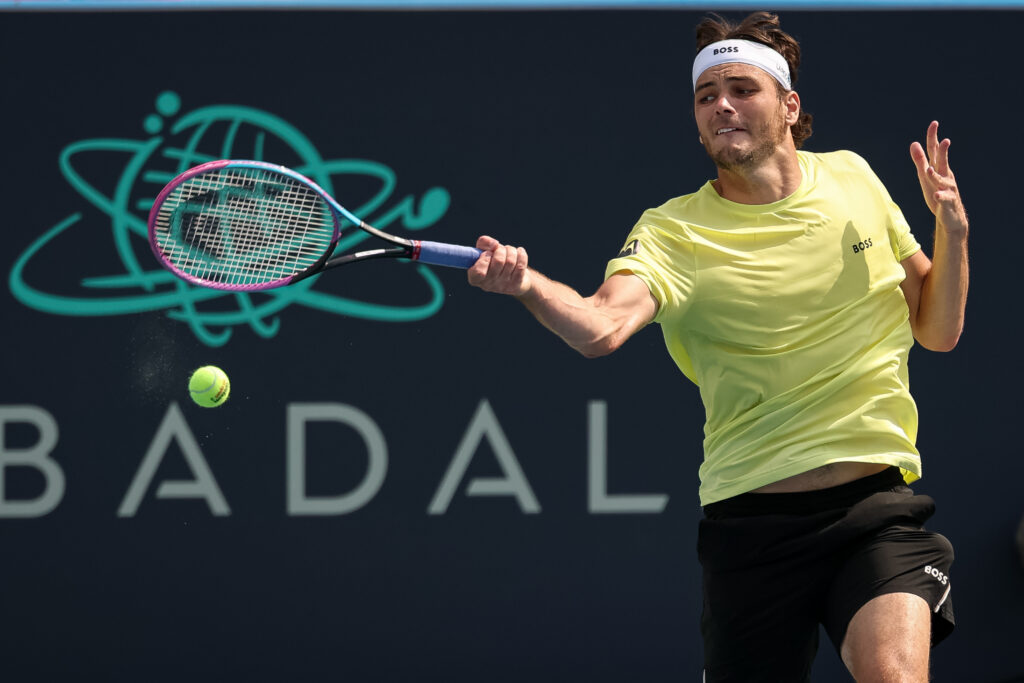 Taylor Fritz hits a forehand