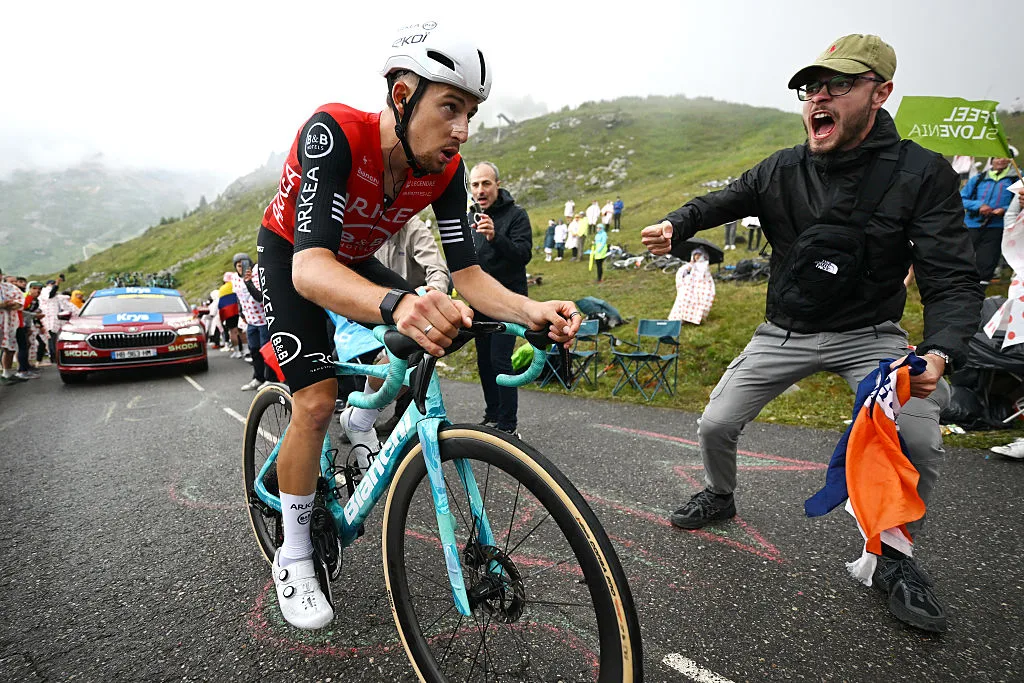 COURCHEVEL - COL DE LA LOZE, FRANCE - JULY 24: Kevin Vauquelin of France and Team Arkea - B&B Hotels competes climbing the Col de la Loze while fans cheer during the 112th Tour de France 2025, Stage 18 a 171.5km stage from Vif to Courchevel - Col de la Loze 2298m / #UCIWT / on July 24, 2025 in Courchevel - Col de la Loze, France. (Photo by Tim de Waele/Getty Images)