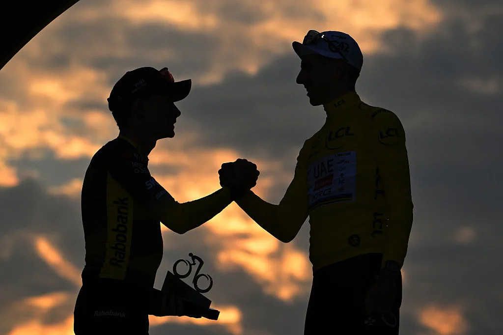PARIS - CHAMPS-ELYSEES, FRANCE - JULY 27: (L-R) Silhouet detailed view of the second classified, Jonas Vingegaard of Denmark and Team Visma | Lease a Bike and final overall winner, Tadej Pogacar of Slovenia and UAE Team Emirates - XRG - Yellow leader jersey congratulate each other at podium during the 112th Tour de France 2025, Stage 21 a 132.3km stage from Mantes-la-Ville to Paris - Champs-Elysees / #UCIWT / on July 27, 2025 in Paris - Champs-Elysees, France. (Photo by Tim de Waele/Getty Images)