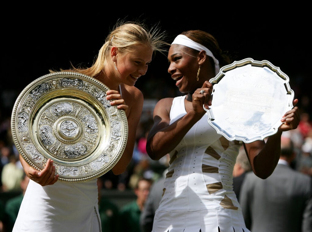 Maria Sharapova of Russia poses with her trophy after she won against Serena Williams of USA in the ladies final match at the Wimbledon Lawn Tennis Championship on July 3, 2004 at the All England Lawn Tennis and Croquet Club.
