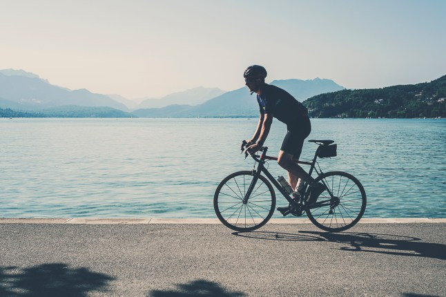 Cyclist along the edge of Lake Annecy
