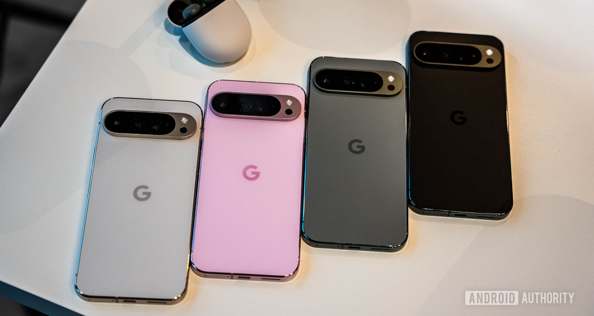 Google Pixel 9 Pro in four colors lined up face down on a table