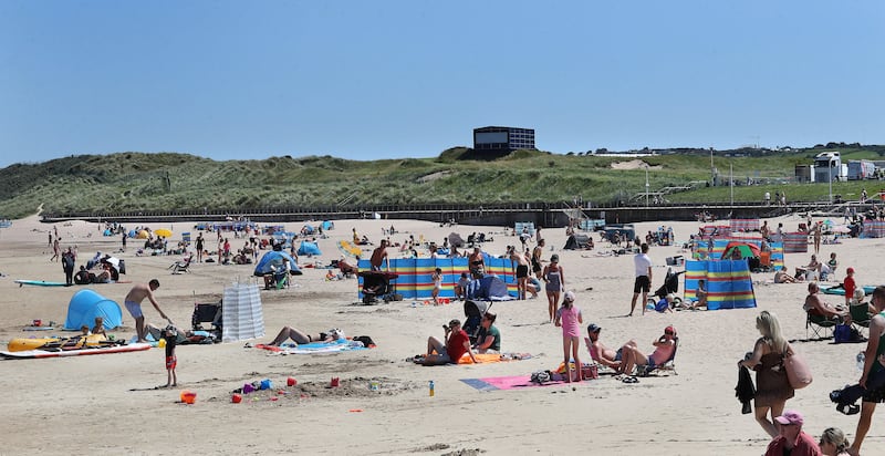 At the beach in Portrush just yards away from The Open golf venue as heatwave conditions continued across the country at the weekend. Picture Margaret McLaughlin 12-7-2025
