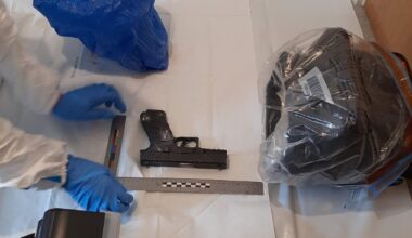 Two charged and firearm seized from Birmingham flat