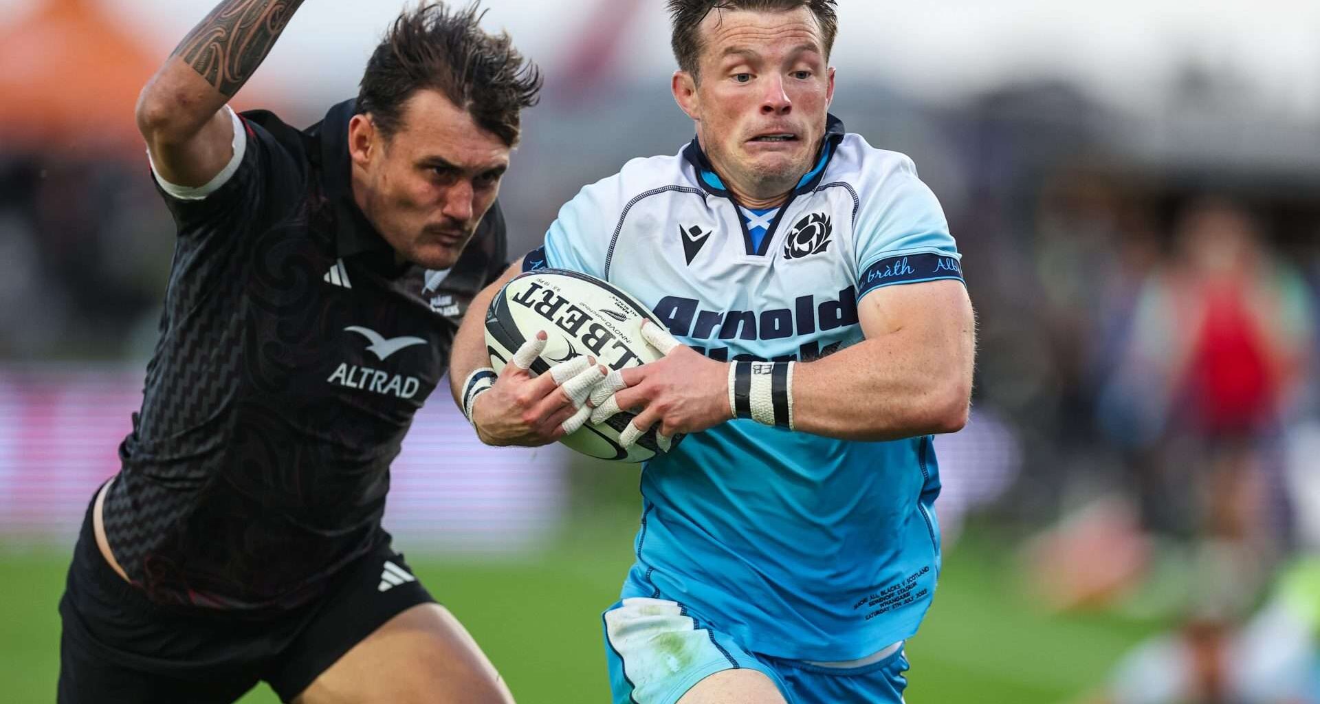 George Horne escapes the clutches of former Glasgow Warriors team-mate Cole Forbes during Scotland's tense victory over the Māori All Blacks at Semenoff Stadium in Whangārei. Image: Fiona Goodall / SNS Group