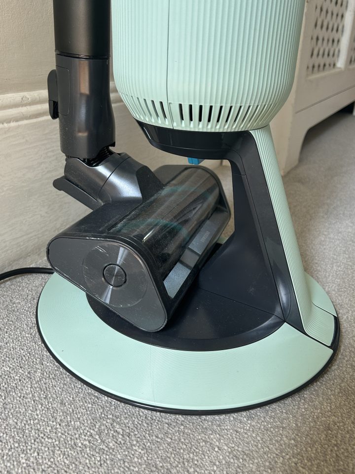 Vacuum cleaner charging on its dock.