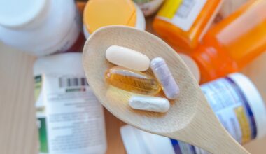 supplements and vitamins are in a wooden spoon