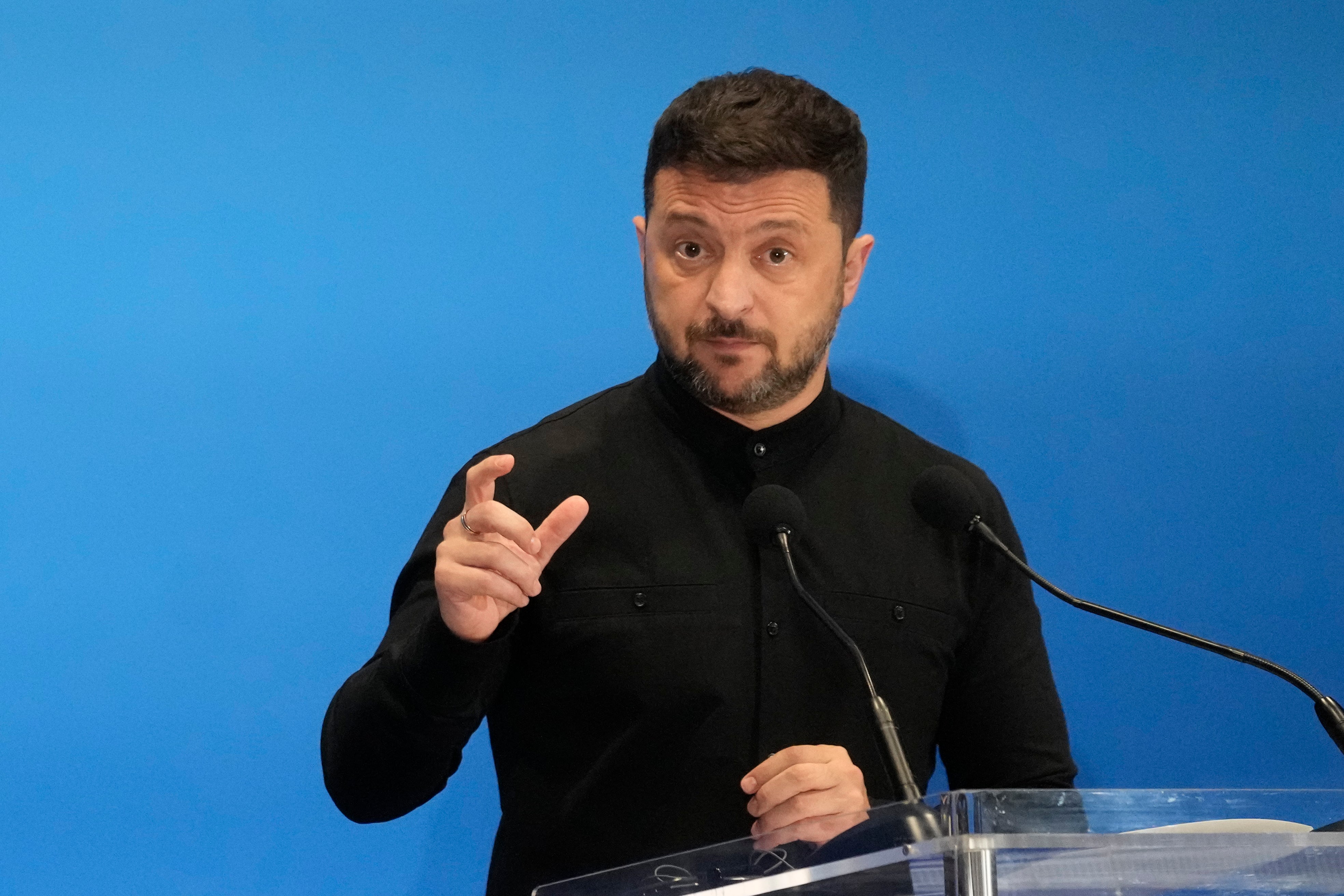 Ukraine's president Volodymyr Zelensky speaks with reporters during the Ukraine Recovery Conference at La Nuvola convention centre in Rome
