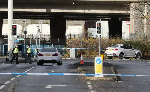 Police at the scene after the murder of Euan Johnston 