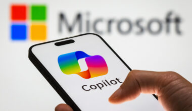 CHONGQING, CHINA - DECEMBER 29: In this photo illustration, a person holds a smartphone displaying the logo of Microsoft Copilot, an AI-powered productivity tool, with the Microsoft logo visible in the background, representing the integration of artificial intelligence into workplace solutions, on December 29, 2024 in Chongqing, China. Artificial Intelligence (AI) has become a cornerstone of Chinaâ€™s strategic ambitions, with the government aiming to establish the country as a global leader in AI by 2030. (Photo illustration by Cheng Xin/Getty Images)