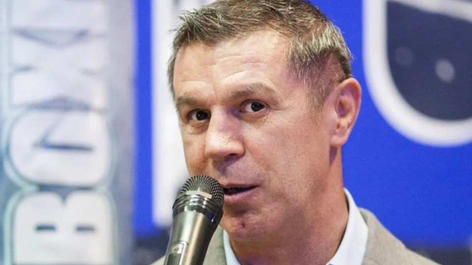 Mihai Leu speaking into a microphone.