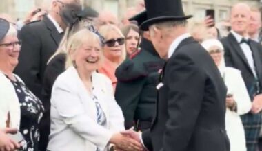King Charles III greets Inverness community stalwart Dell McClurg during Royal Garden Party at the Palace of Holyroodhouse in Edinburgh
