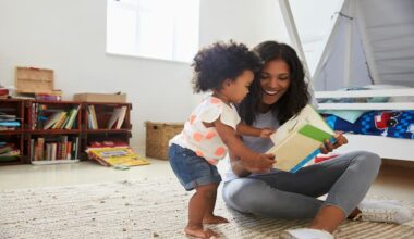 Mother and young daughter reading books at home.