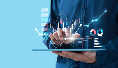 Businessman trading online stock market on teblet screen, digital investment concept