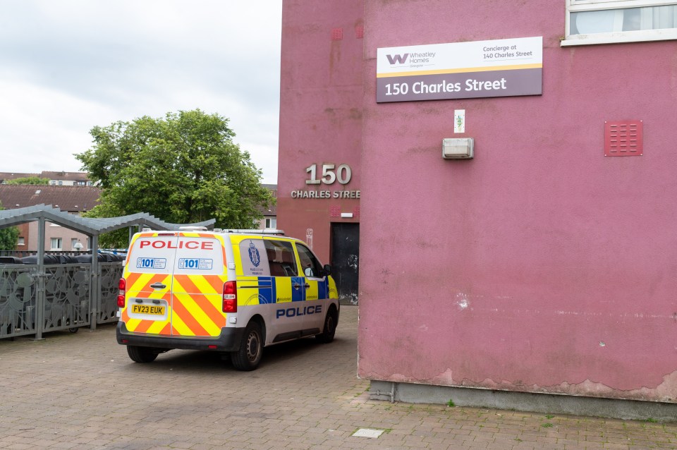 Police van parked outside 150 Charles Street.
