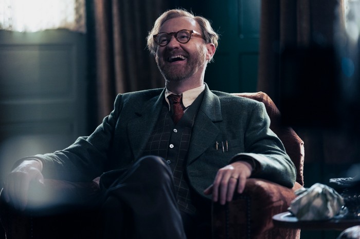 Mark Gatiss in Bookish, sat in an armchair, laughing