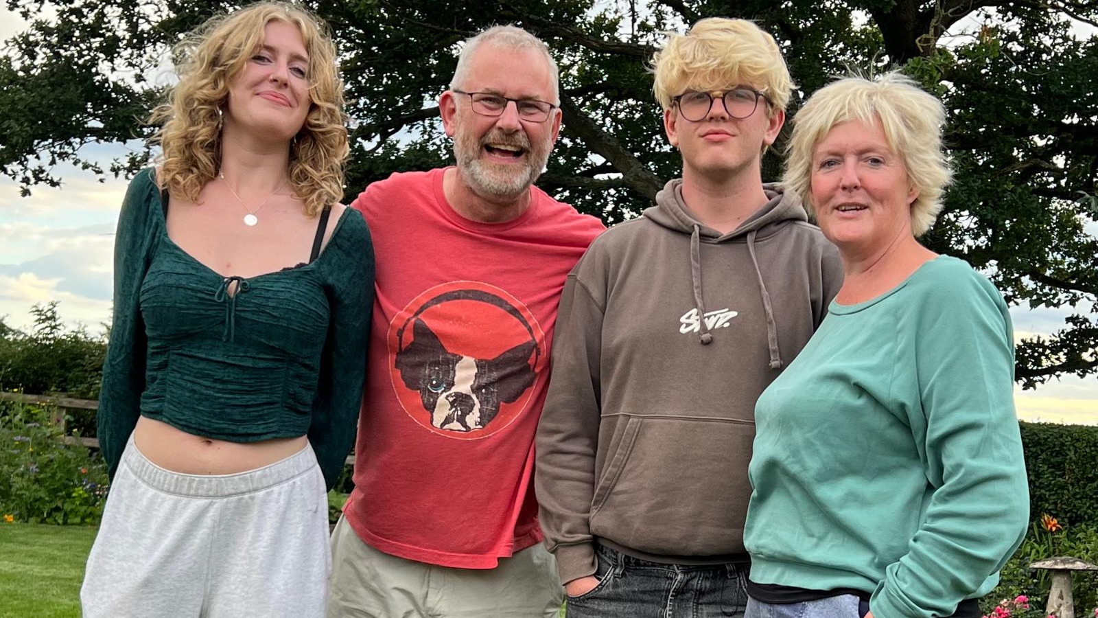 The Dexter family – Katie, Mark, Harry and Kara Dexter – smile together, outdoors