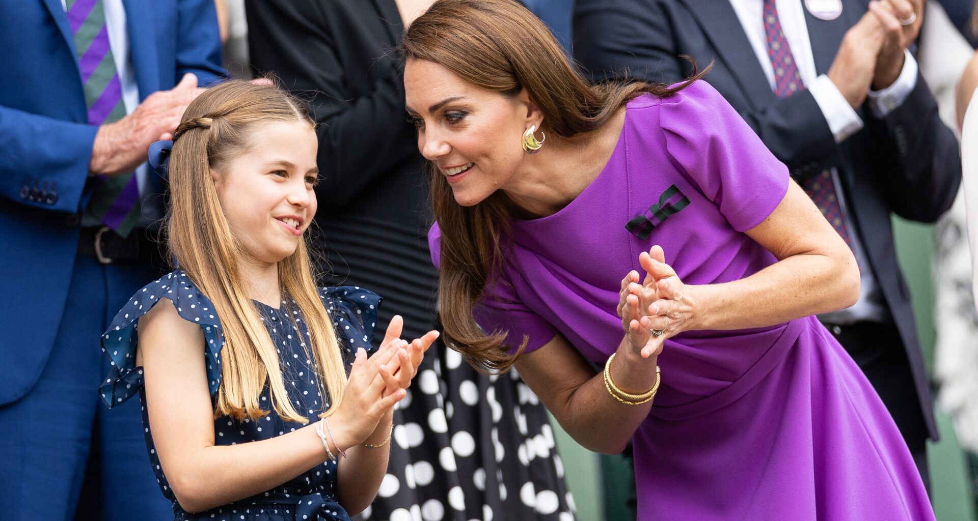 Catherine, Princess of Wales talks with Princess Charlotte of Wales in the Royal Box at Wimbledon on July 14th, 2024