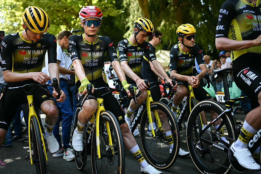 (From L) Team Visma - Lease a bike team's US rider Matteo Jorgenson, Team Visma - Lease a bike team's Danish rider Jonas Vingegaard and Team Visma - Lease a bike team's US rider Sepp Kuss, and Team Visma - Lease a bike team's Belgian rider Tiesj Benoot await the start of the 9th stage of the 112th edition of the Tour de France cycling race, 174.1 km between Chinon and Chateauroux, central France, on July 13, 2025. (Photo by Loic VENANCE / AFP) (Photo by LOIC VENANCE/AFP via Getty Images)