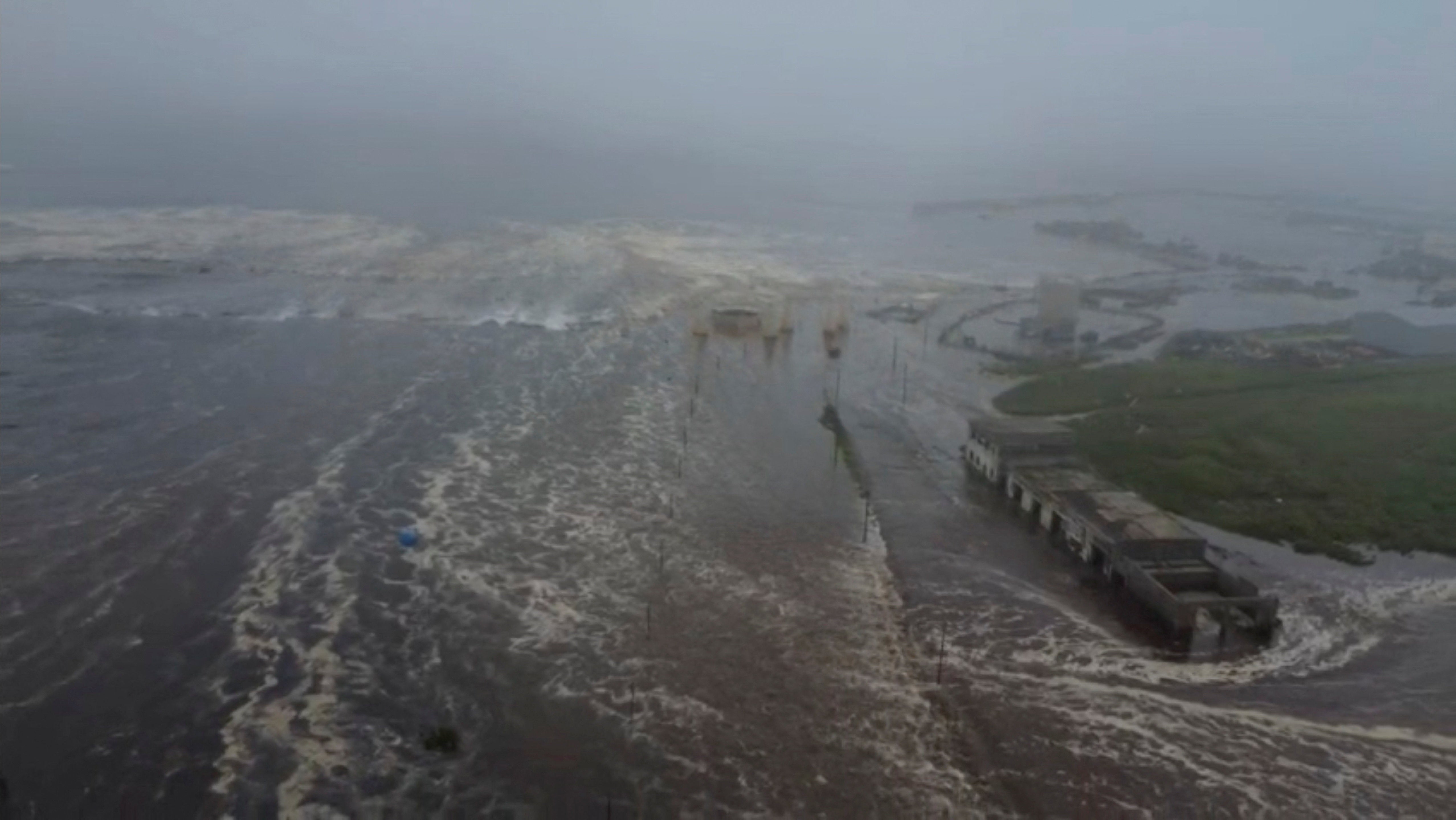 Tsunami waves flood an area after a powerful magnitude 8.8 earthquake struck off Russia's far eastern Kamchatka Peninsula, in Severo-Kurilsk, Sakhalin Region, Russia, July 30, 2025, in this still image taken from video. Kamchatka branch of the Geophysical Survey of the Russian Academy of Sciences/Handout via REUTERS