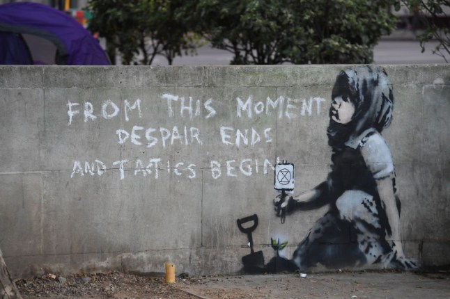 New Banksy Appears Overnight At Marble Arch After Extinction Rebellion Two Week Campaign Ends..A Mural Appeared Overnight At The Climate Change Protest Camp In Marble Arch. Protesters Claimed The Stencil Was A Banksy But It Is Yet To Be Officially Confirmed As A Work By The Artist..It Is On A Wall Next To A Tent Where Steve Jones Has Been Staying Since The Weekend. He Said: I Was Away From 7.30Pm Till 10Pm Last Night And He Must Have Done It Then. I Can'T Believe It 26-April-2019 (Photo by Jeremy Selwyn/Evening Standard via Getty Images)
