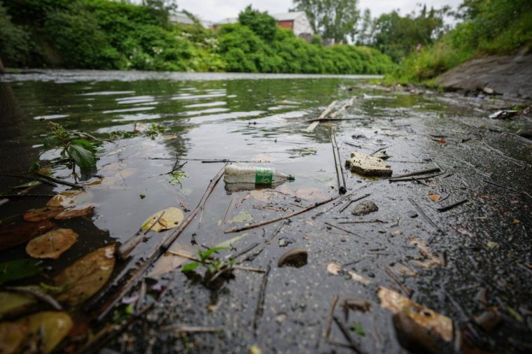 BOLTON, UNITED KINGDOM - JUNE 24: Treated effluent flowing into the River Irwell from the Bolton Wastewater Treatment Works operated by United Utilities Ltd on June 24, 2025 in Bolton, United Kingdom. Water companies will now have to use nature-based solutions when managing wastewater, as the The Water (Special Measures) Act 2025 comes Into Force. (Photo by Christopher Furlong/Getty Images)