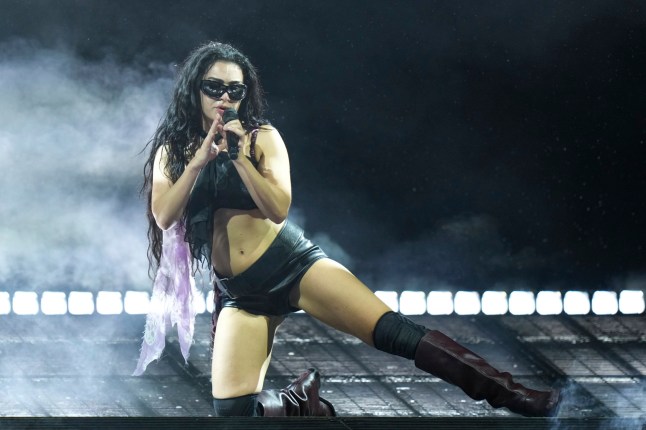 Charli xcx performs during the Glastonbury Festival in Worthy Farm, Somerset, England, Saturday, June 28, 2025. (Scott A Garfitt/Invision/AP)