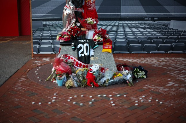 epa12214130 Candles spell out 'Jota' underneath the statue of Bill Shankly at Anfield, the home of Liverpool FC in Liverpool, Britain 03 July 2025. Jota died in a car accident in Spain together with his brother Andre Silva on 03 July 2025. EPA/ADAM VAUGHAN