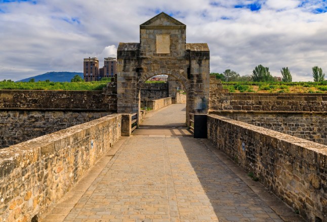 A gate and pathway of the citadel, medieval fortifications in old town Pamplona, Navarra, Spain famous for the running of the bulls