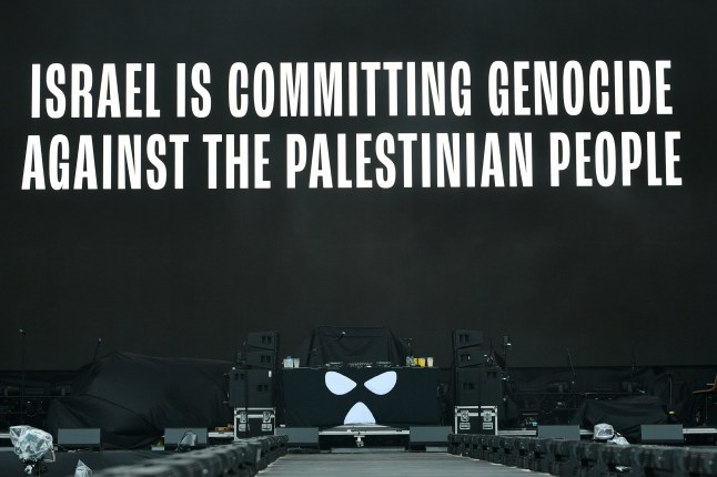 LONDON, ENGLAND - JULY 05: A message of support for Palestine is screened before Kneecap take to the stage at Finsbury Park, as support to Fontaines DC, on July 05, 2025 in London, England. (Photo by Jim Dyson/Getty Images)