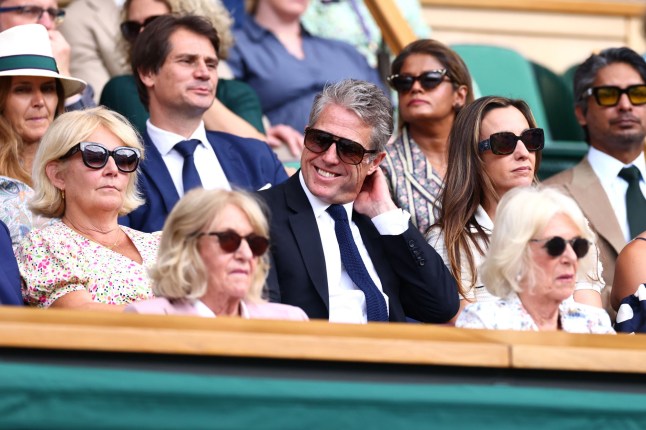 Mandatory Credit: Photo by James Marsh/Shutterstock (15389394cn) Hugh Grant watches Novak Djokovic during his Quarter Final match against Flavio Cobolli Wimbledon Tennis Championships, Day 10, The All England Lawn Tennis and Croquet Club, London, UK - 09 Jul 2025