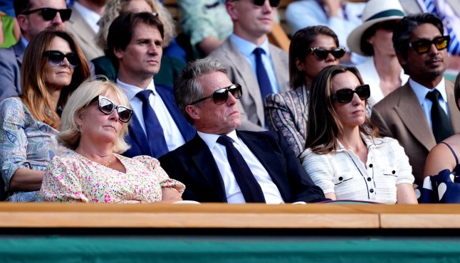 Hugh Grant in the Royal Box with his wife Anna (right) on day ten of the 2025 Wimbledon Championships at the All England Lawn Tennis and Croquet Club, London. Picture date: Wednesday July 9, 2025. PA Photo. Photo credit should read: John Walton/PA Wire. RESTRICTIONS: Editorial use only. No commercial use without prior written consent of the AELTC. Still image use only - no moving images to emulate broadcast. No superimposing or removal of sponsor/ad logos.