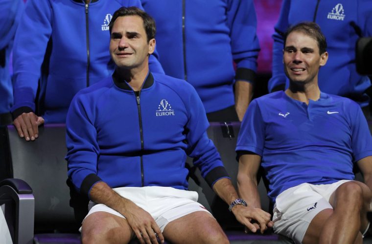 Roger Federer and Rafael Nadal in tears and holding hands after their doubles game against Frances Tiafoe and Jack Sock, the final match before Federer's retirement, during day one the Laver Cup tennis tournament at the O2 Arena on September 23rd 2022 in Greenwich, London (Photo by Tom Jenkins/Getty Images)