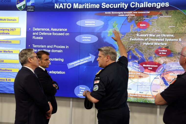 France's President Emmanuel Macron (2nd-L) and Britain's Prime Minister Keir Starmer (L) listen to a NATO military officer during a Coalition of the Willing meeting at a military base at Northwood Headquarters in north-west London, on July 10, 2025. (Photo by Ludovic MARIN / POOL / AFP) (Photo by LUDOVIC MARIN/POOL/AFP via Getty Images)