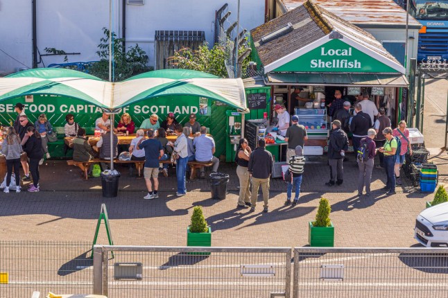 September 19, 2024. Scotland, Oban. Outdoor seafood stall.
