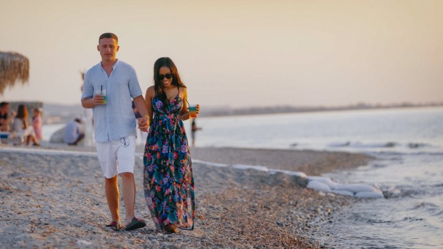 Shorna and Adnand walking along a beach together on 90 Day Fiance