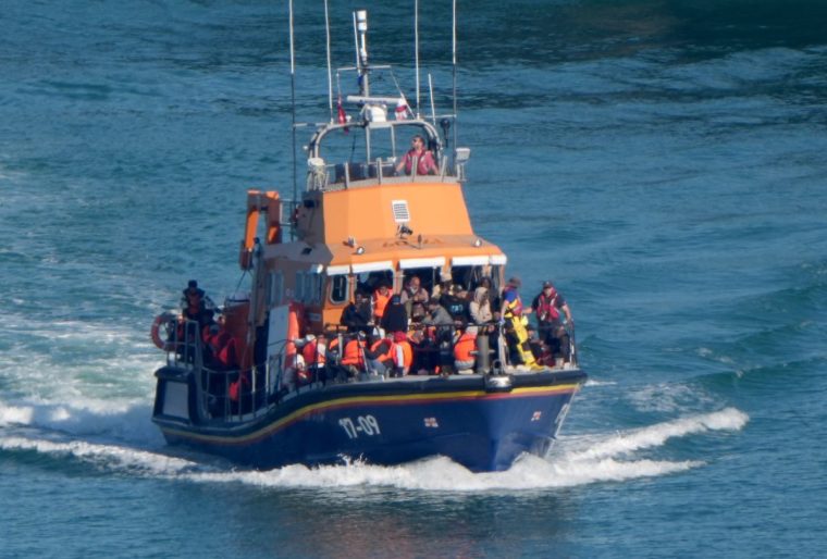 A group of people thought to be migrants are brought in to Dover, Kent, onboard an RNLI Lifeboat following a small boat incident in the Channel. Picture date: Thursday July 10, 2025. PA Photo. Photo credit should read: Gareth Fuller/PA Wire