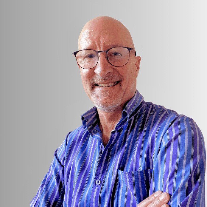 Mike Bailey poses for a photograph
