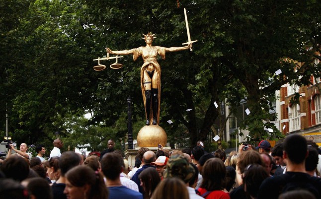 LONDON - AUGUST 4: Cult graffiti artist Banksy unveils his latest 20-foot high, 3-tonne concrete and bronze sculpture at Clerkenwell Green on August 4, 2004 in London. The artwork is described by its creator as 