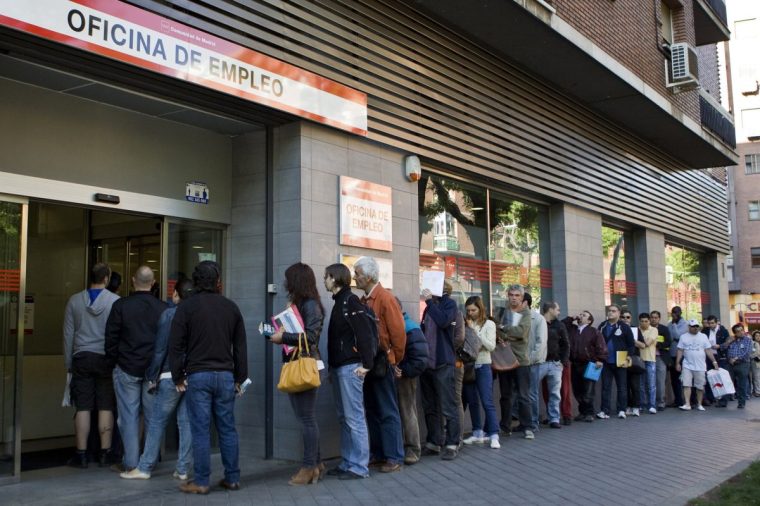 (FILES) People wait in line at a government employment office in Madrid on June 4, 2013. Spain's unemployment rate climbed to nearly 26 percent in the first quarter of 2014 as millions searched in vain for a job in a sluggish recovery from recession figures from the National Statistics Institute indicated on April 29, 2014. AFP PHOTO/ SEBASTIEN BERDA (Photo credit should read SEBASTIEN BERDA/AFP via Getty Images)
