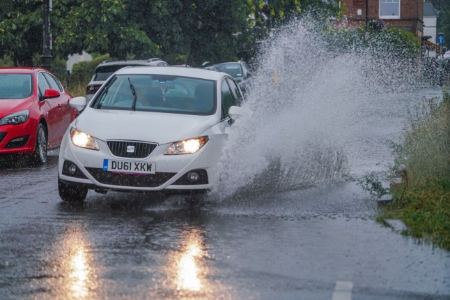 Mandatory Credit: Photo by Amer Ghazzal/Shutterstock (15405640b) A motorist drving on a waterlogged road in Wimbledon , south west London this morning. The met office has issued an amber warning for thunderstorms for London and parts of southern England Seasonal Weather, Wimbledon, London, United Kingdom - 19 Jul 2025